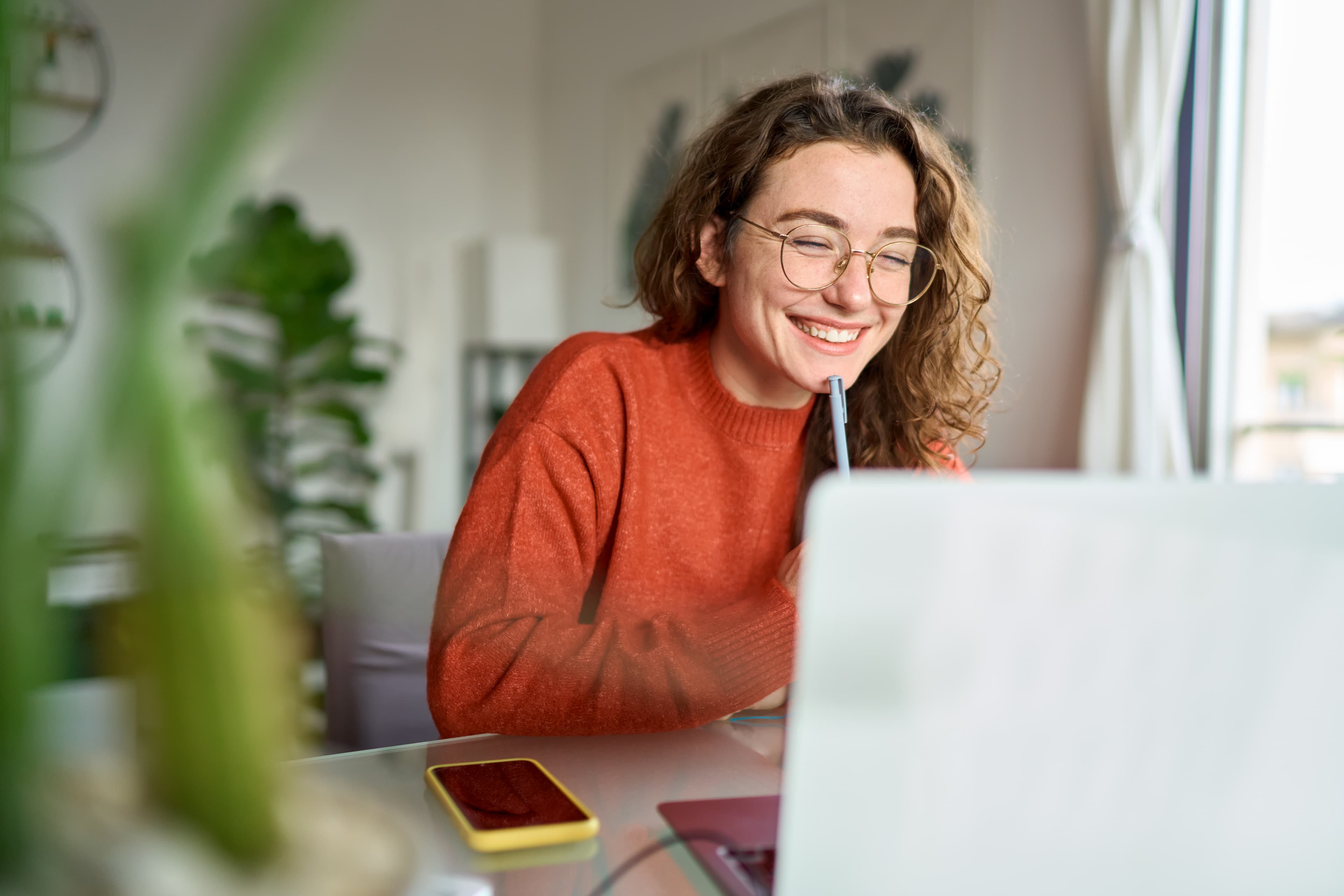 Student studying for the Digital SAT with laptop and notes